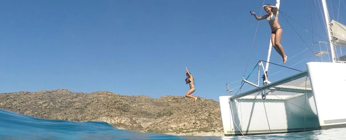 Girls diving from the bow a lagoon 450F