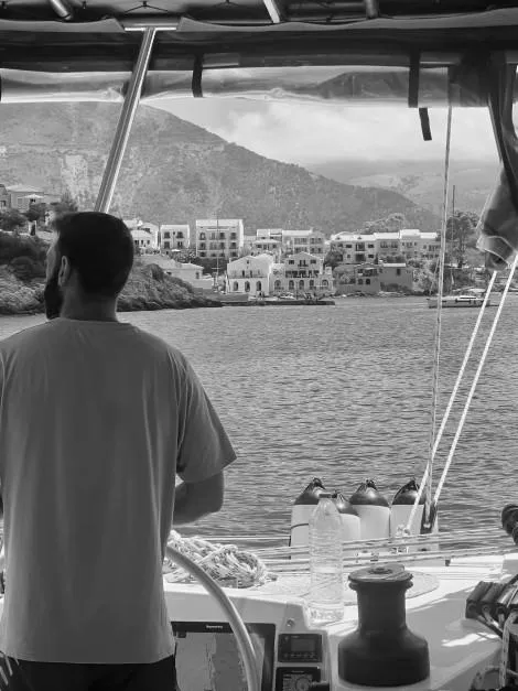 skipper on the helm, Asos Kefalonia, Ionian Islands.
