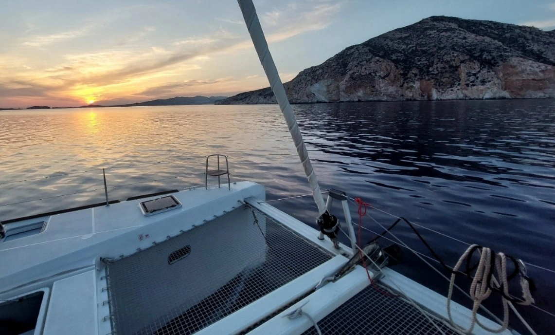 Lagoon 450F on achor during sunset, ionian islands